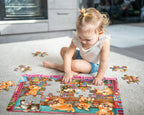 Child assembling the Shiba's Candy Store puppy-themed floor puzzle on the floor