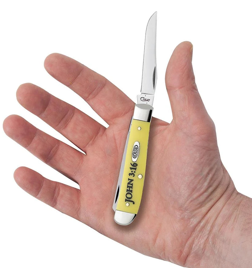 Case Mini Trapper knife with yellow handle and silver blade held in hand