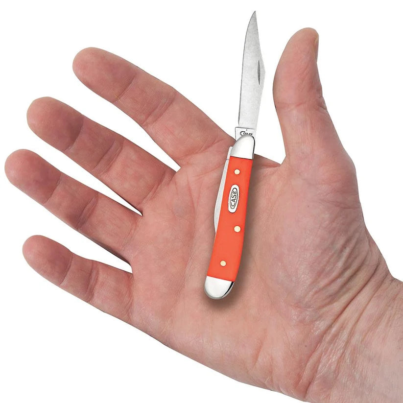Case Peanut orange synthetic pocket knife held in a hand with Clip blade open