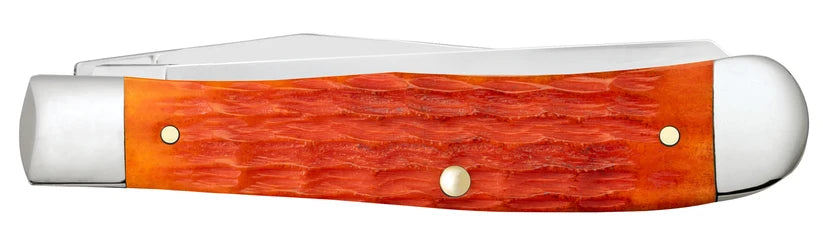Reverse side of closed Case Tequila Sunrise Bone Trapper with orange-red jigged handle
