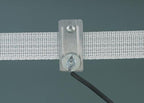 Poly tape electrical connector installed on an electric fence