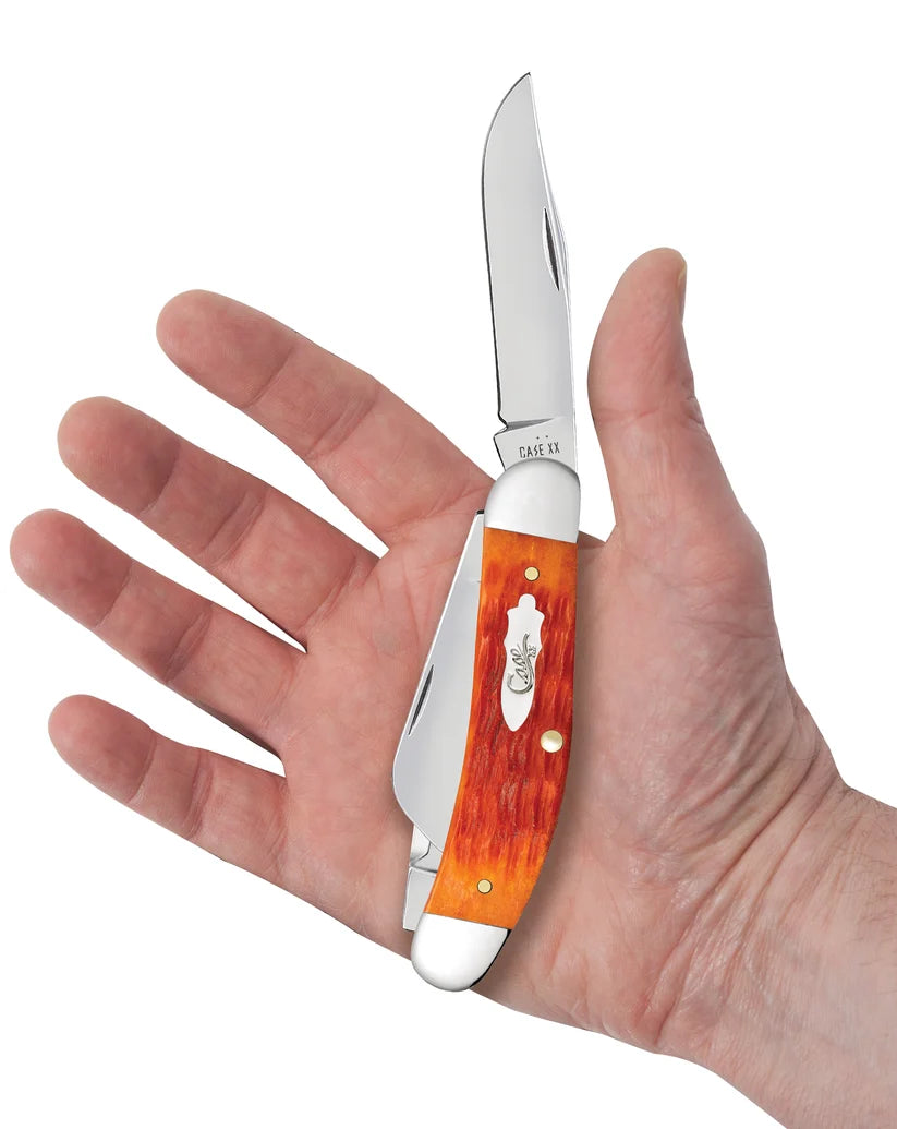 Case Tequila Sunrise Bone Sowbelly held in a hand to show its size