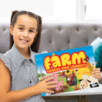Child holding the Farm Snakes and Ladders game box