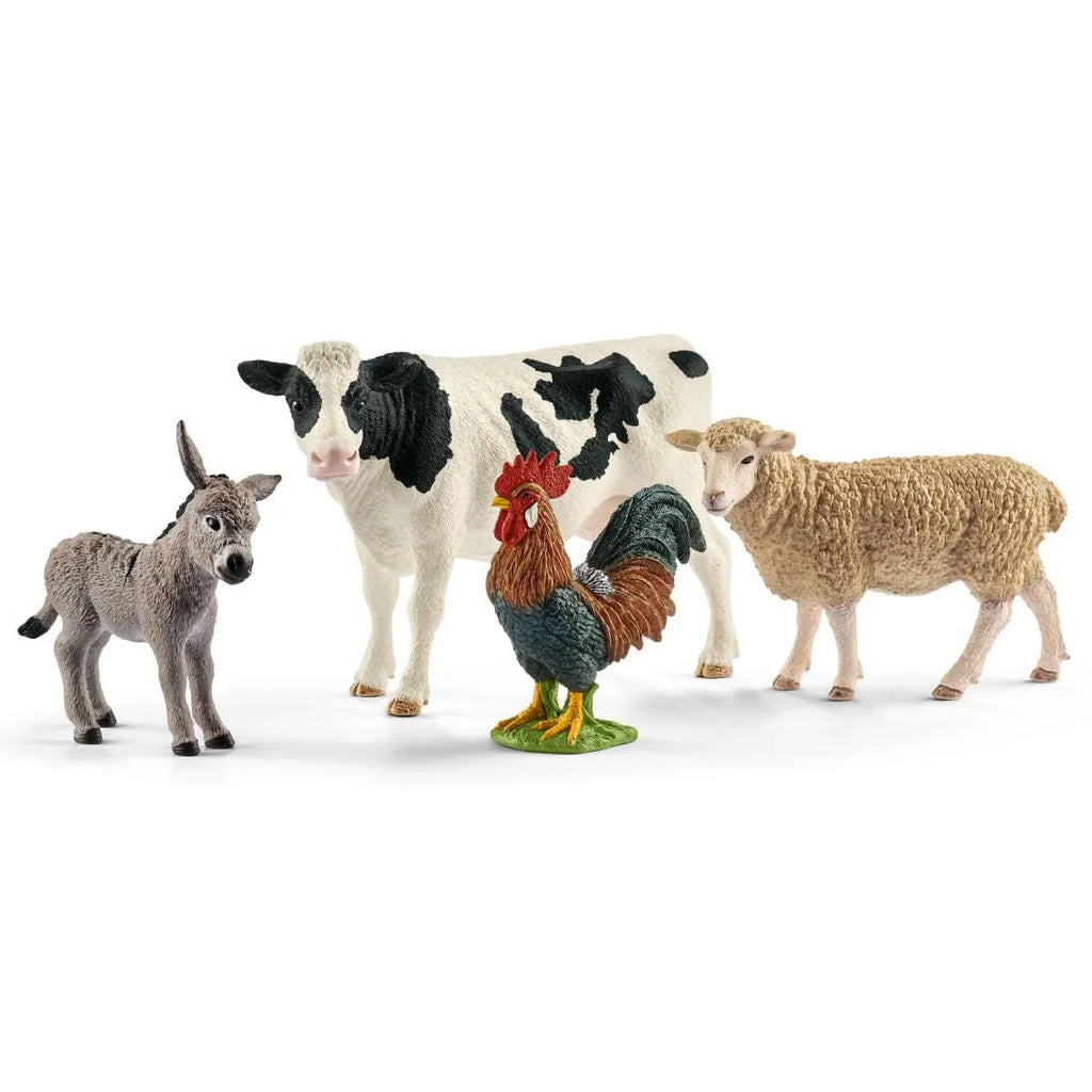 Schleich Barnyard Buddies set with donkey, black-and-white cow, rooster, and sheep figures on a white background.
