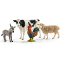 Schleich Barnyard Buddies set with donkey, black-and-white cow, rooster, and sheep figures on a white background.