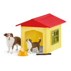 Schleich Friendly Dog House playset with yellow dog house, red roof, adult dog, puppy, bowl, bone and stick