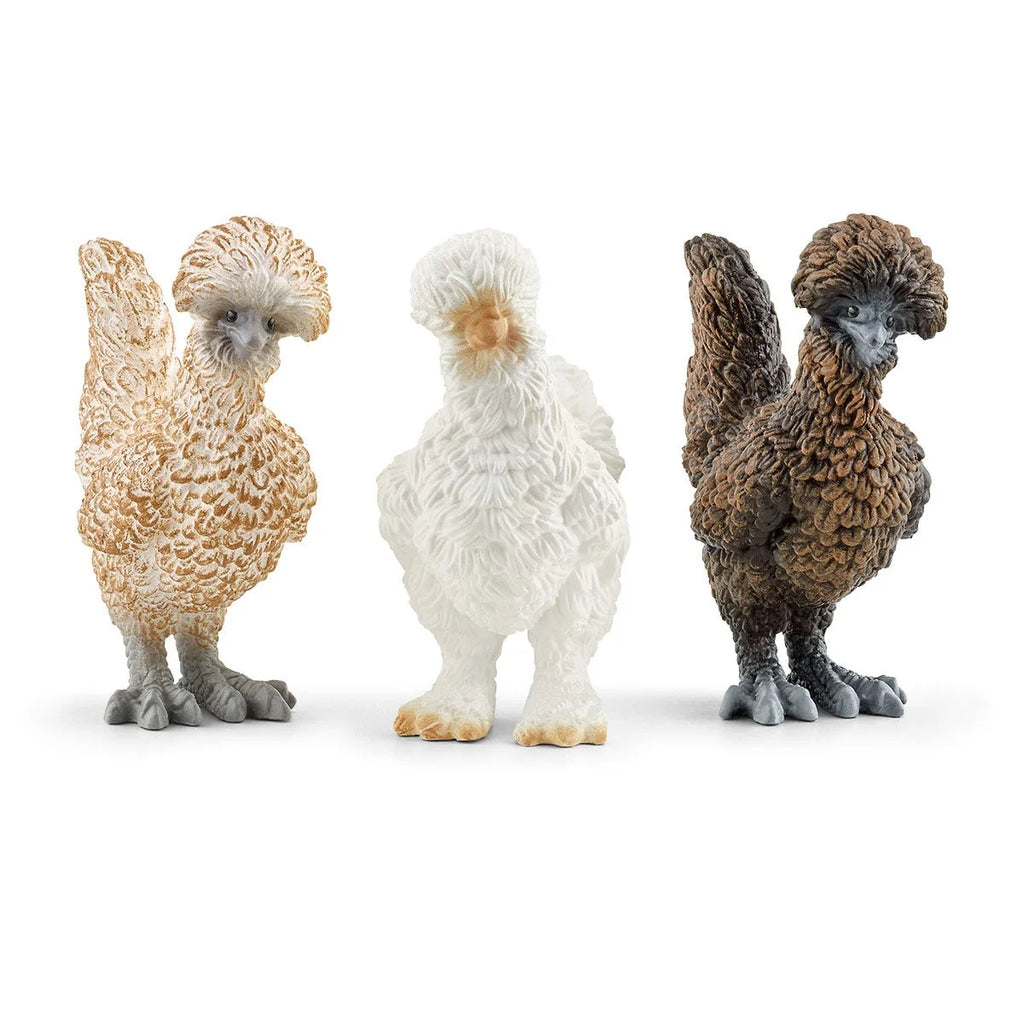 Three Schleich Chicken Friends figures in cream, white, and brown