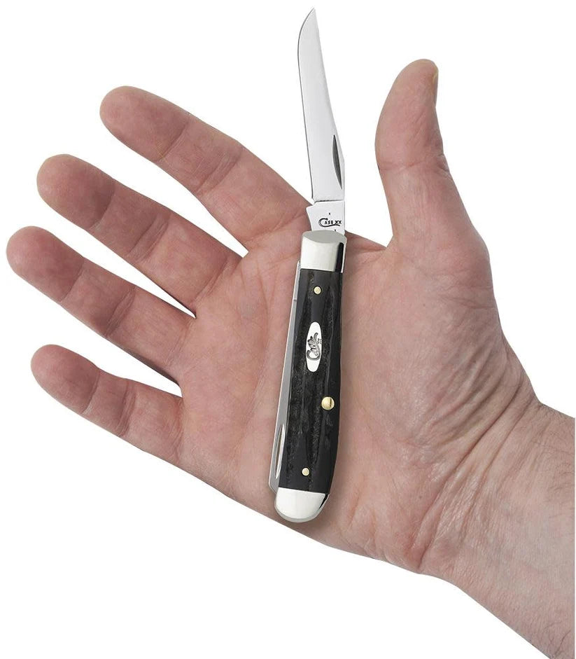 Case Jigged Buffalo Horn Mini Trapper knife held in a hand with Clip blade open