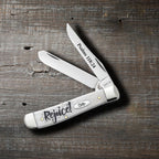 Case Rejoice Embellished Smooth Natural Bone Mini Trapper pocket knife with both blades open on a rustic wood surface, Psalms 118:24 on the Clip blade