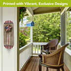 American Barnstar thermometer mounted on a white porch wall beside wicker chairs.
