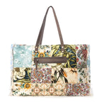 Multi patch canvas weekender with leather handles and fringe