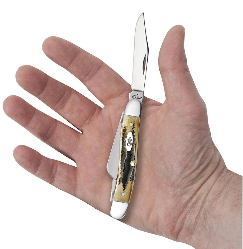 Case 6.5 BoneStag Medium Stockman knife held in a hand with Clip blade open