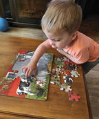 Child assembling the Red Barn Farm animal-themed tray puzzle with colorful farm animal pieces
