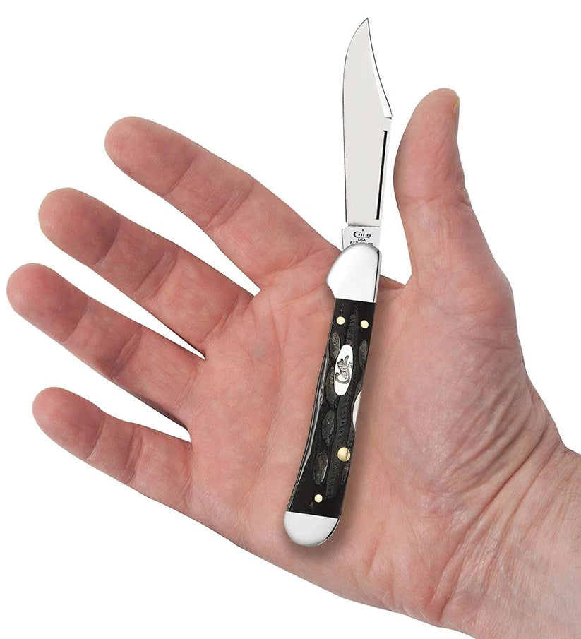 Case Jigged Buffalo Horn Mini CopperLock knife held in a hand with clip blade open