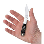 Case Jigged Buffalo Horn Barlow knife held in a hand with Clip blade open