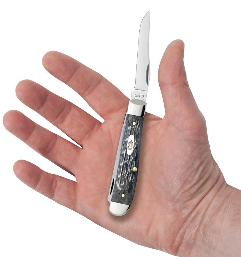  Case Gray Bone Mini Trapper pocket knife held in a hand with one blade open, showing its pocket size