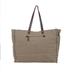 Turquoise embossed leather and canvas weekender bag with Southwest hardware