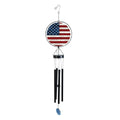 American flag wind chime with a round wood-grain flag design, black chime tubes, and a blue hanging wind catcher.