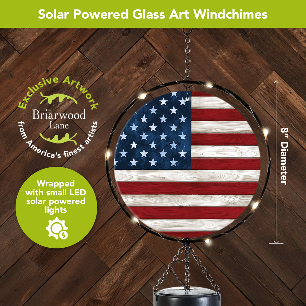 Close-up of the 8-inch American flag glass panel surrounded by glowing solar-powered LED lights.