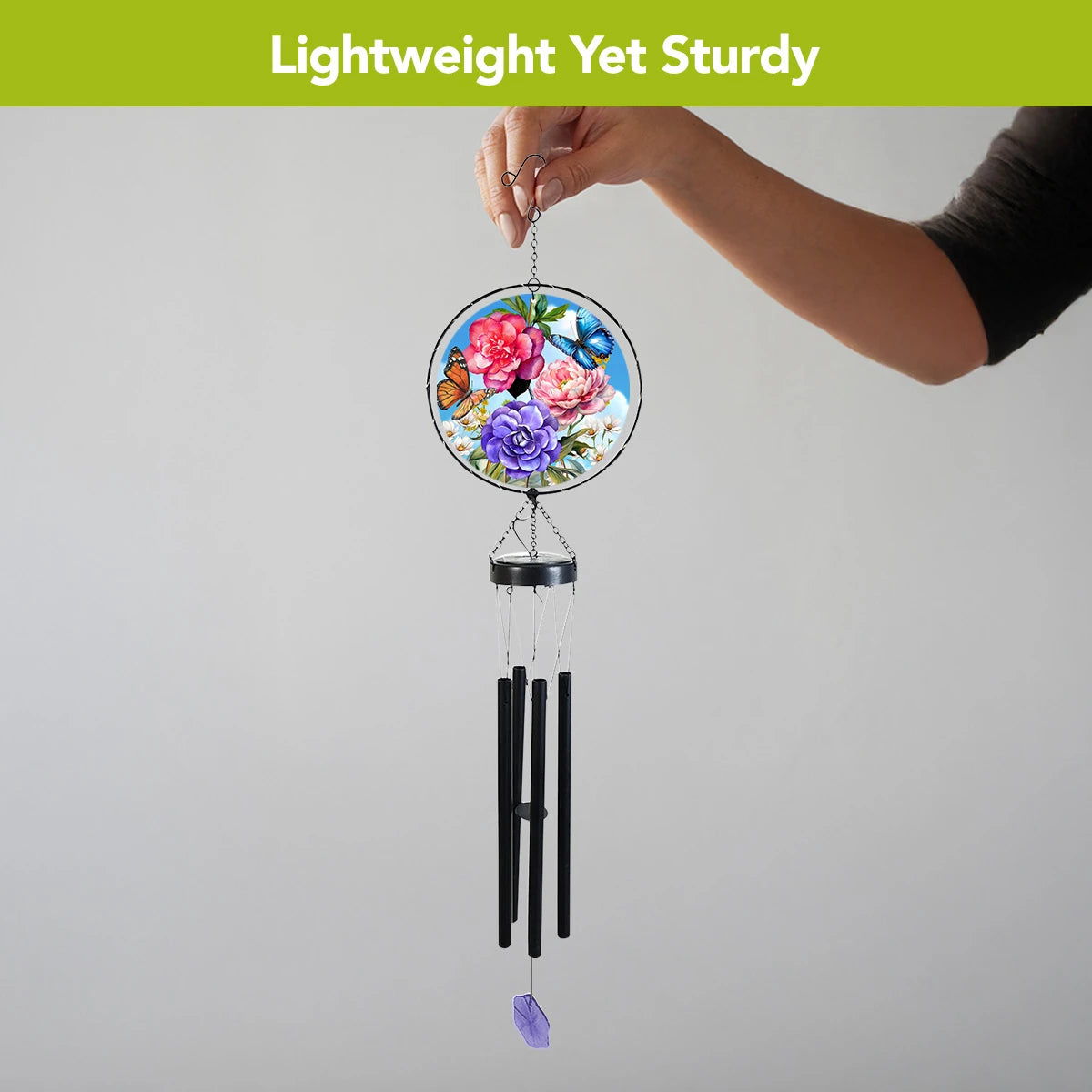  Person holding the butterfly and peony wind chime by its hook, showing its full hanging length