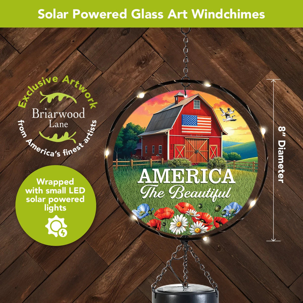 Close-up of the 8-inch American Barn glass light catcher surrounded by glowing solar LED lights