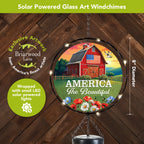 Close-up of the 8-inch American Barn glass light catcher surrounded by glowing solar LED lights
