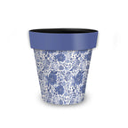 Briarwood Lane blue and white floral planter with a solid blue rim.