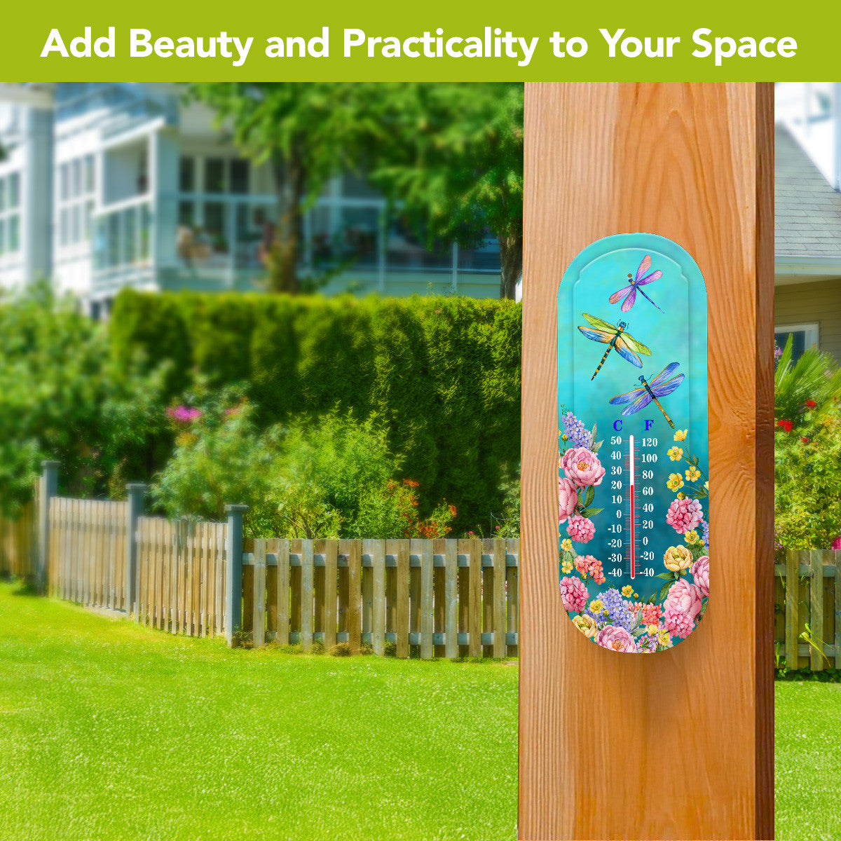 Dragonfly Garden metal thermometer mounted on a wooden post overlooking a lawn and garden.