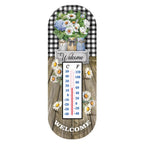 Crated Mason Jars metal thermometer with flowers in jars, a checked border, Welcome lettering, and dual temperature scales.