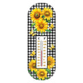 Metal thermometer with yellow sunflowers, butterflies, a black-and-white checkered background, and Celsius and Fahrenheit scales.