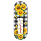 Metal thermometer with yellow sunflowers, butterflies, a black-and-white checkered background, and Celsius and Fahrenheit scales.