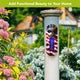Garden image: “Freedom Eagle metal thermometer mounted on a white post beside colorful garden flowers.”