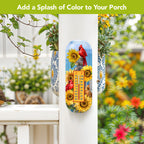Cardinals and sunflowers metal thermometer mounted on a white porch post beside a blue-and-white hanging planter.