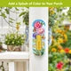 Butterflies and Peonies metal thermometer mounted on a white porch post beside flowers.