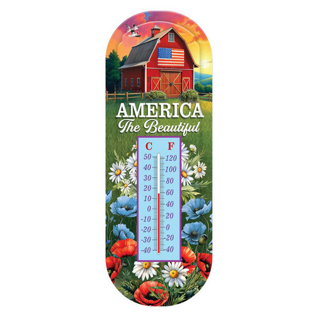  “Briarwood Lane American Barn metal thermometer with a red barn, American flag, colorful flowers, and ‘America the Beautiful’ lettering.”