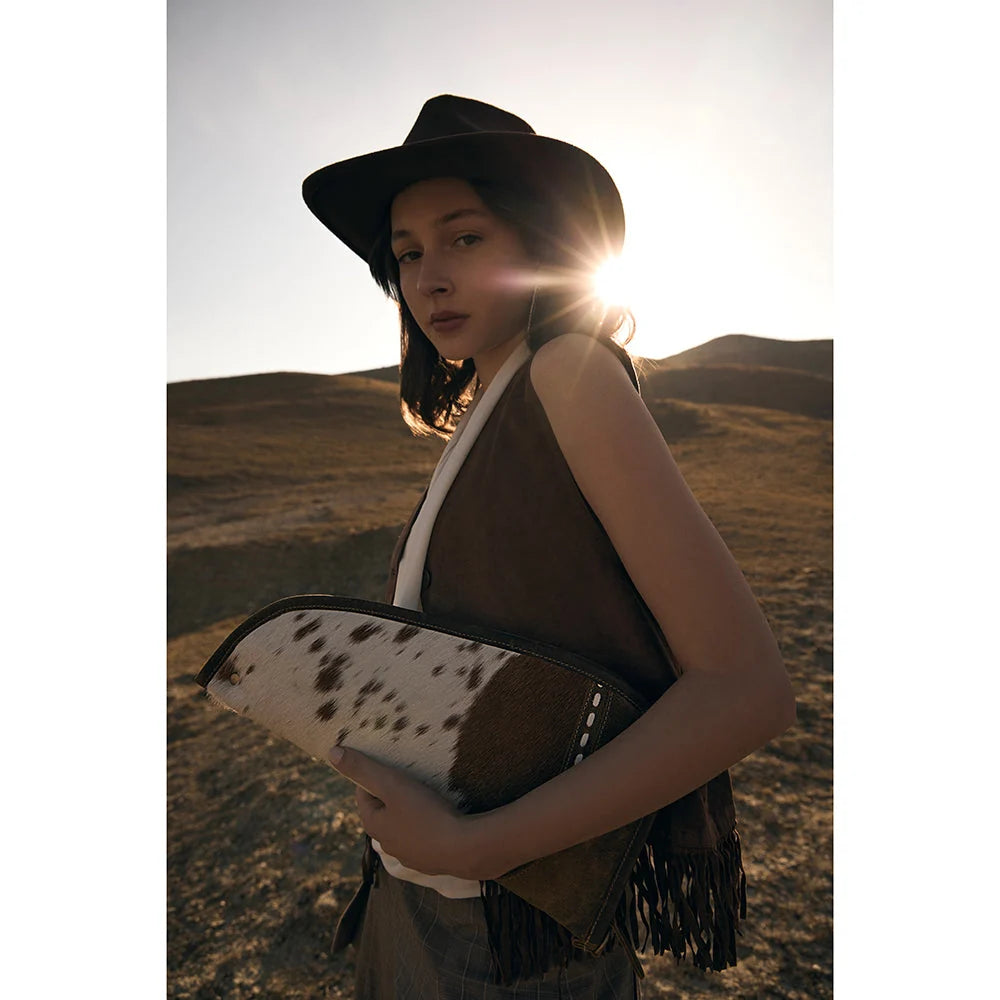 Dusty Trail 15-inch hair-on hide and leather gun case S-9595 lifestyle view | DeKalb Farmers Co-op