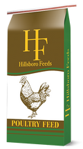 Hillsboro Feeds poultry feed bag with a chicken illustration and green, white and brown packaging.