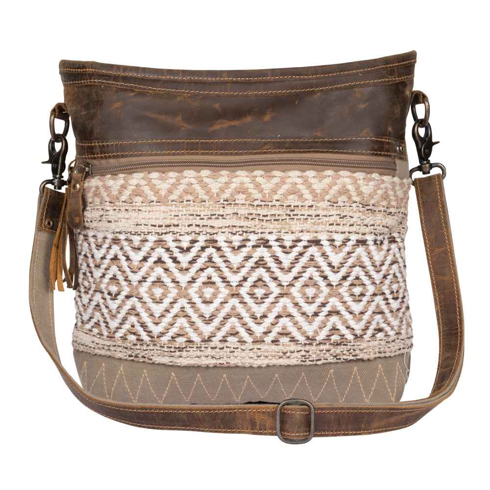 Front view of Myra Blending Taste Aztec Shoulder Bag with brown leather trim and neutral woven Aztec pattern