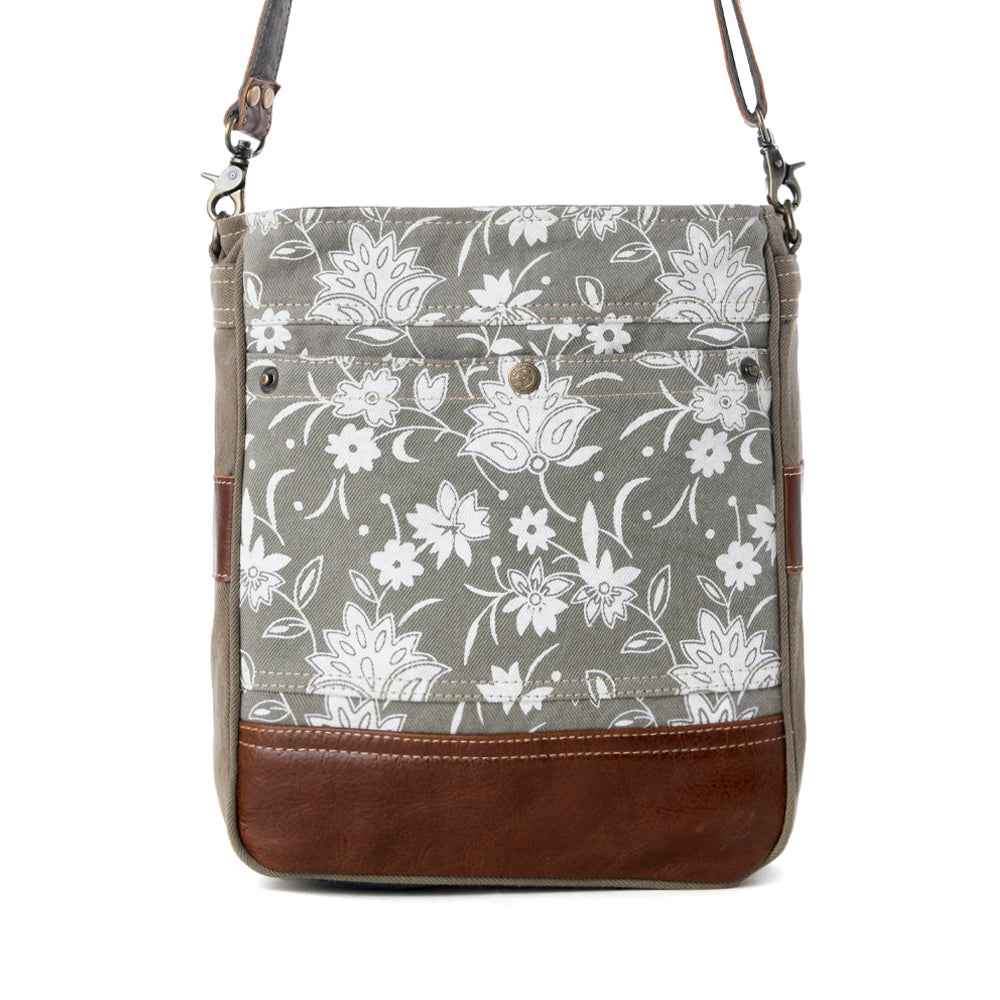 Front view of Myra Blossom Print Shoulder Bag with gray and white floral canvas and brown genuine leather trim