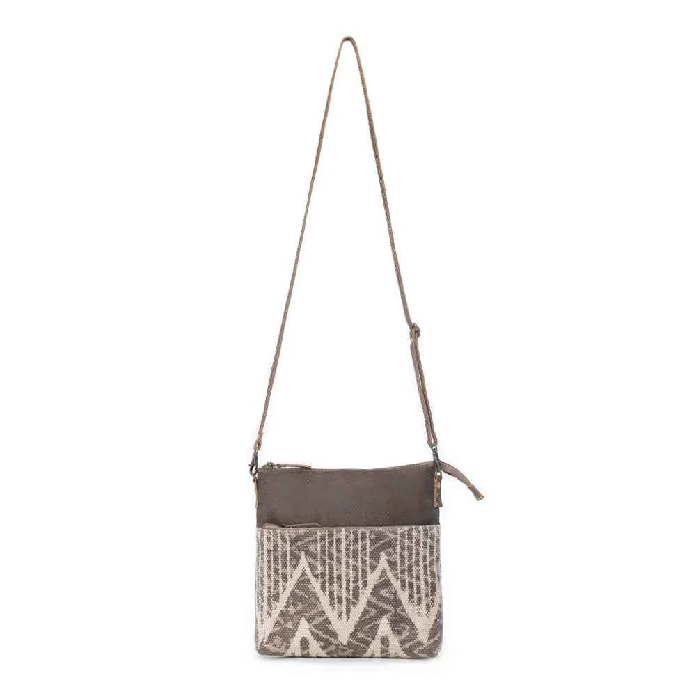 Full view of Myra Coffee Canvas Crossbody Bag with neutral geometric rug design and adjustable leather shoulder strap