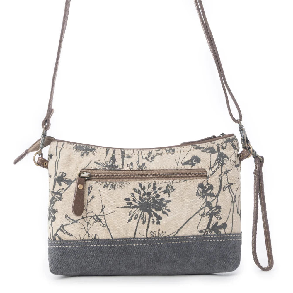 Back view of Myra Dainty Delight floral canvas crossbody bag with exterior zipper pocket