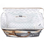 Interior view of Myra Dakota Trail Weekender Bag with patterned cotton lining and interior zipper pocket