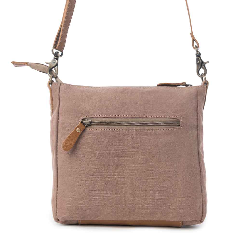 Back view of Myra Dizzy Circle Floral Shoulder Bag with neutral canvas and exterior zipper pocket