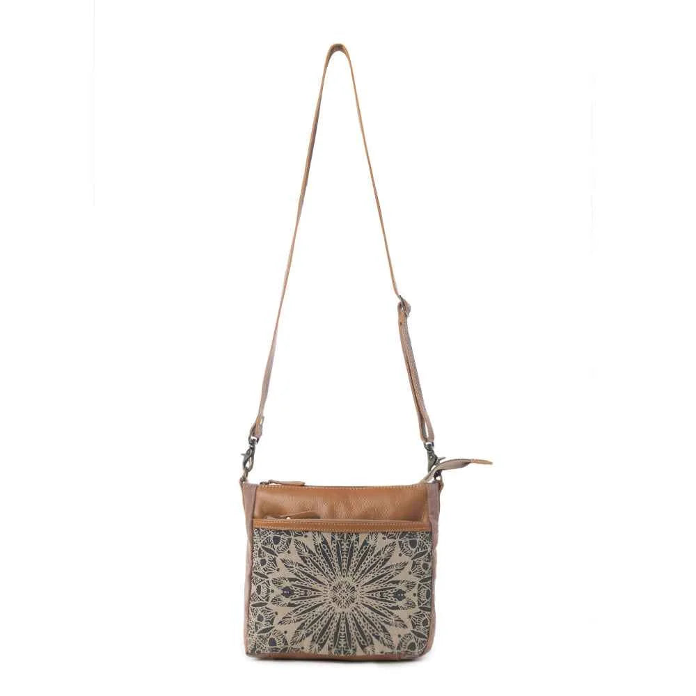 Full view of Myra Dizzy Circle Floral Shoulder Bag with sunburst floral print and adjustable leather shoulder strap