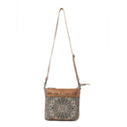 Full view of Myra Dizzy Circle Floral Shoulder Bag with sunburst floral print and adjustable leather shoulder strap