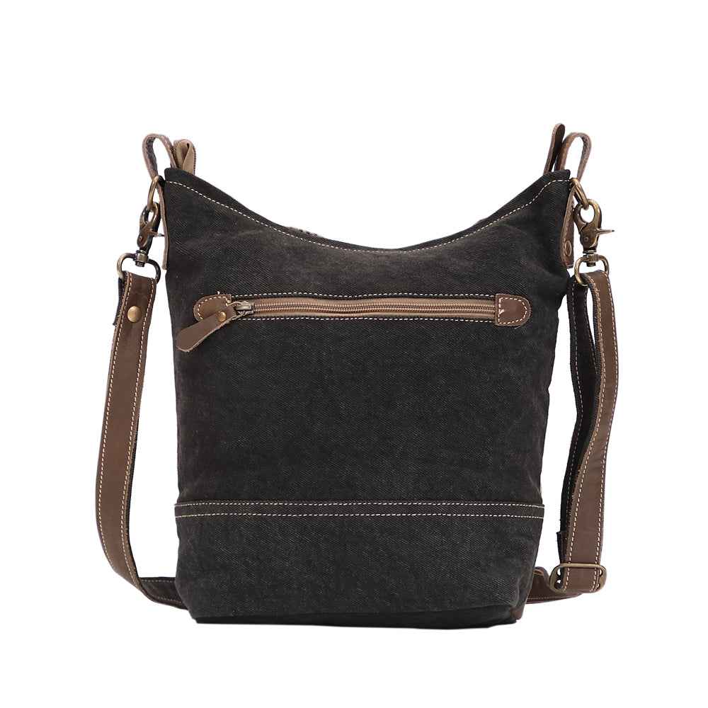 Back view of Myra floral canvas shoulder bag with dark upcycled canvas, leather trim and exterior zipper pocket