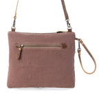 Back view of Myra Floral Flow Crossbody Bag with brown canvas, leather accents and exterior zipper pocket