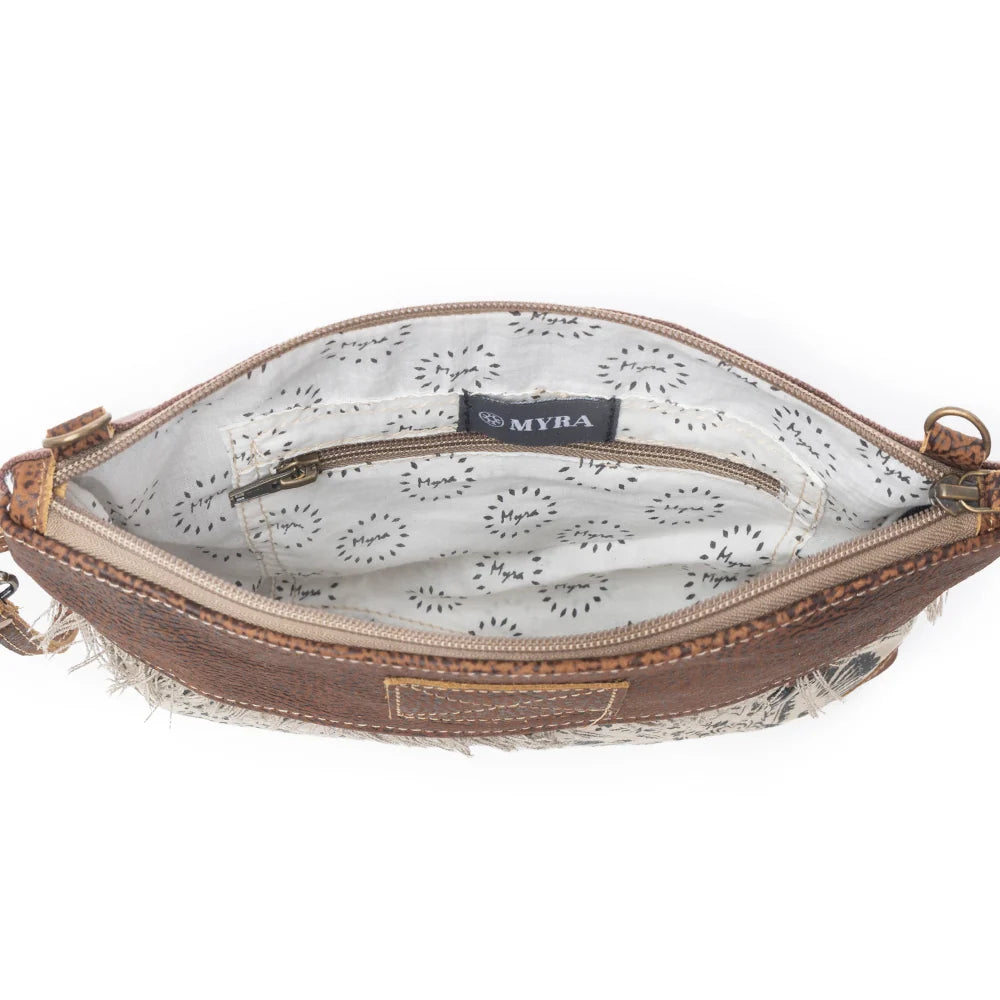 Interior view of Myra Floral Flow Crossbody Bag with patterned lining and interior zipper pocket