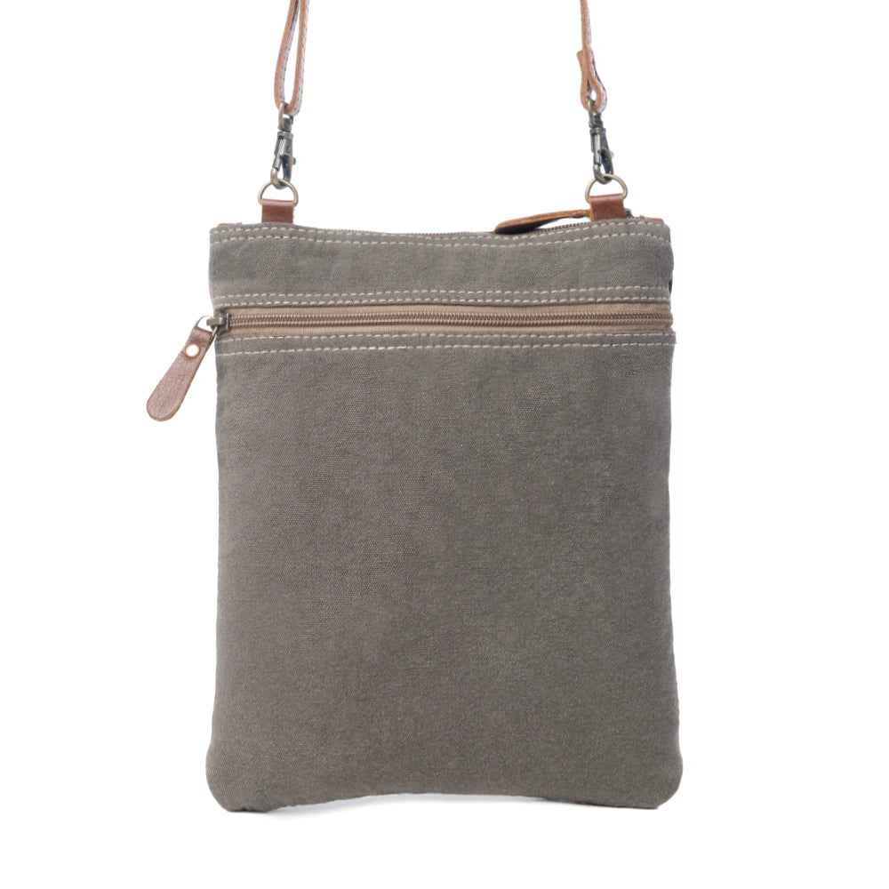 Back view of Myra Honey Bee Print crossbody bag with gray canvas and zippered pocket.