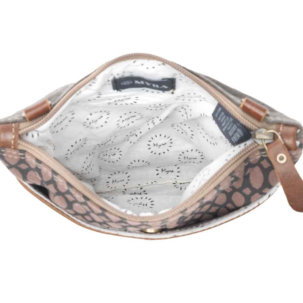 : Interior view of Myra Honey Bee Print crossbody bag showing patterned cotton lining and zippered opening.